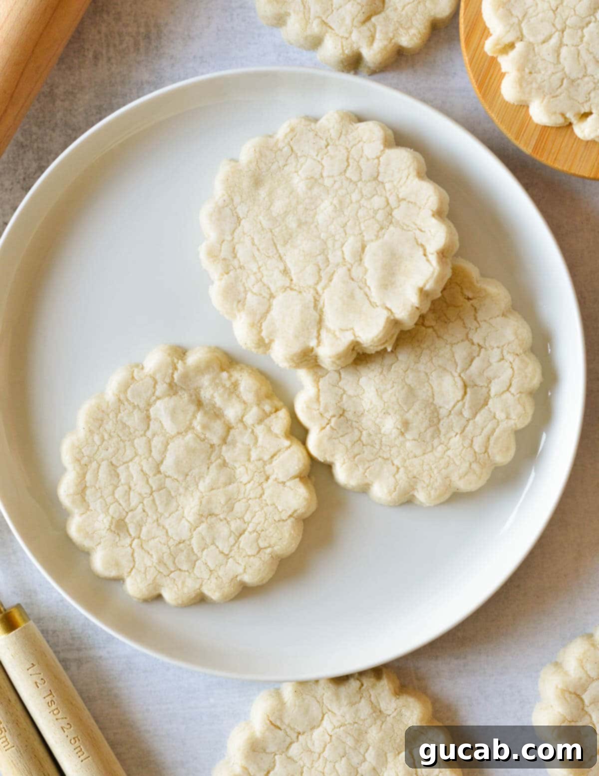 Buttery Gluten-Free Shortbread 2 gluten free shortbread cookies on a plate.