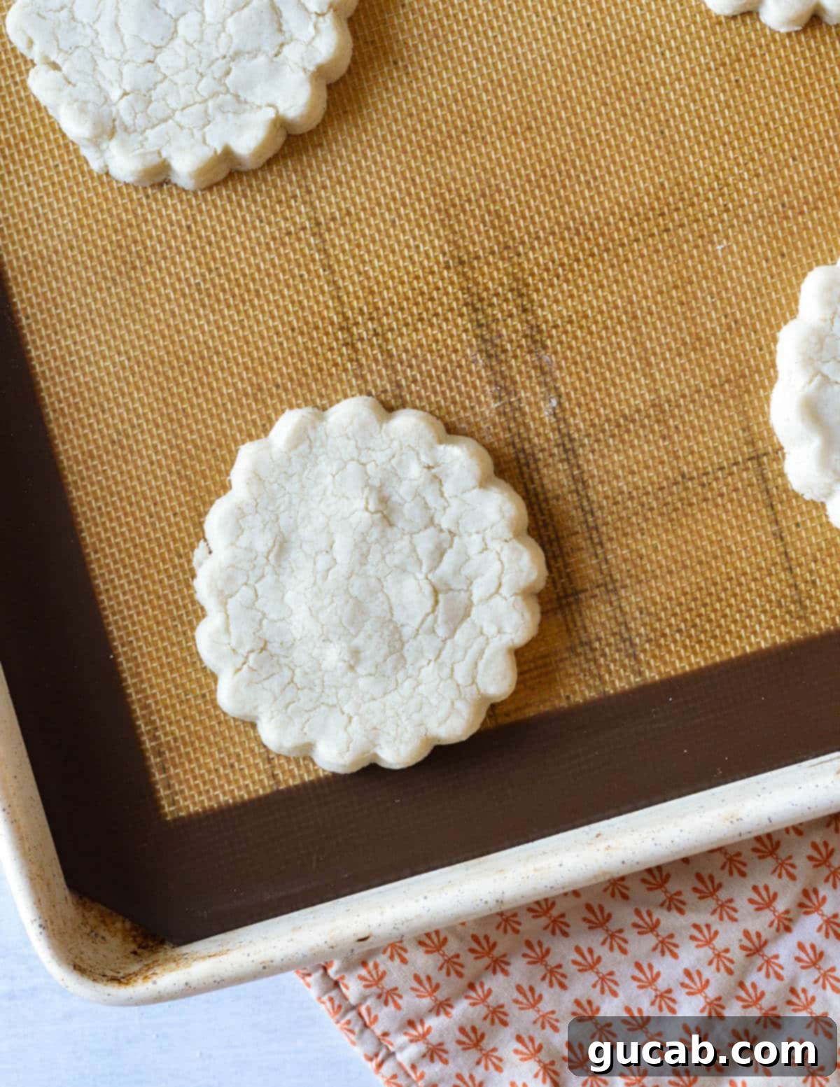 Buttery Gluten-Free Shortbread 11 baked gluten free shortbread cookie on a sheet pan.