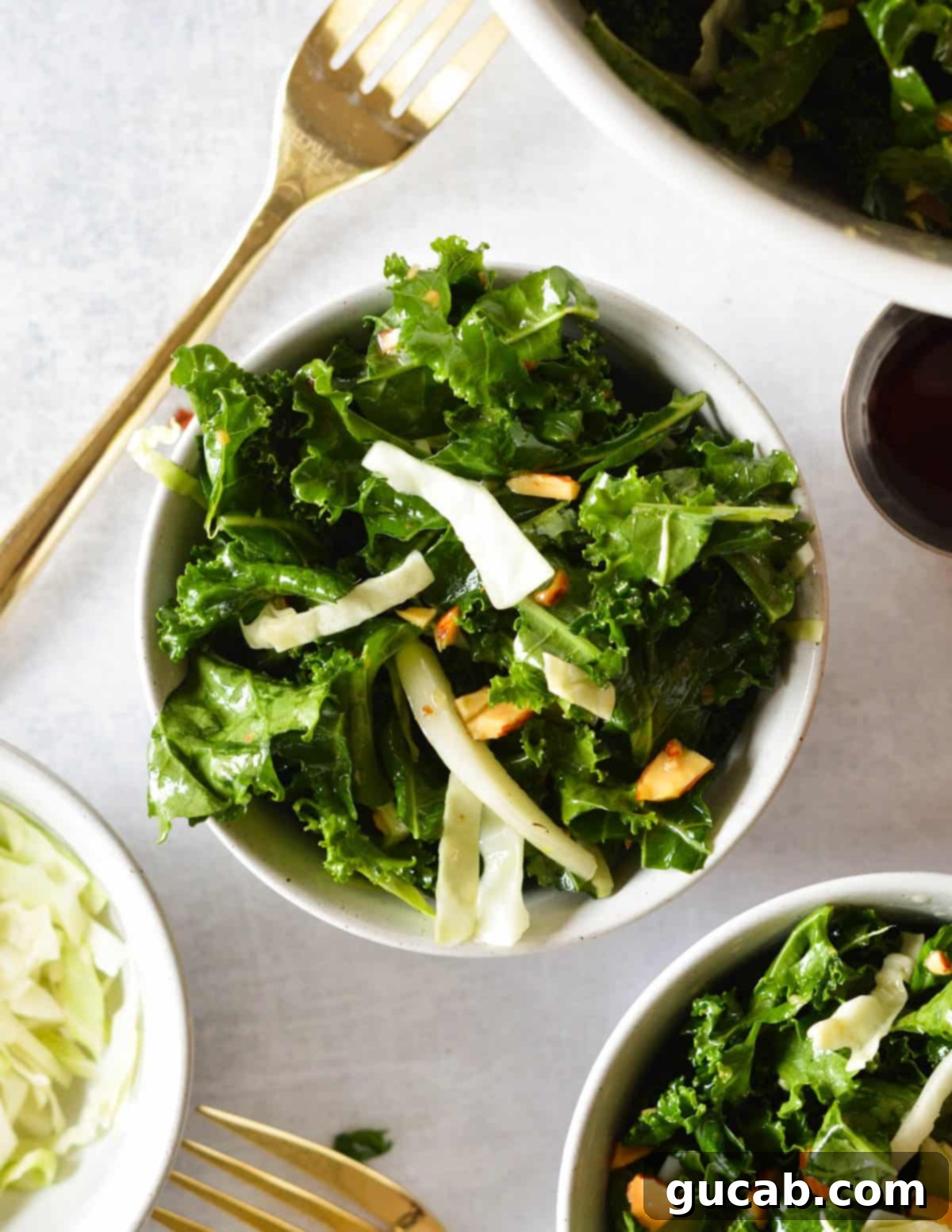 Kale Crunch Salad 2 a bowl of kale salad with cabbage and almonds.