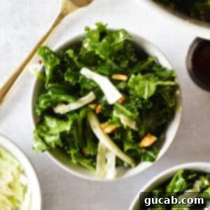 Kale Crunch Salad 14 kale salad with cabbage and almonds in a bowl.