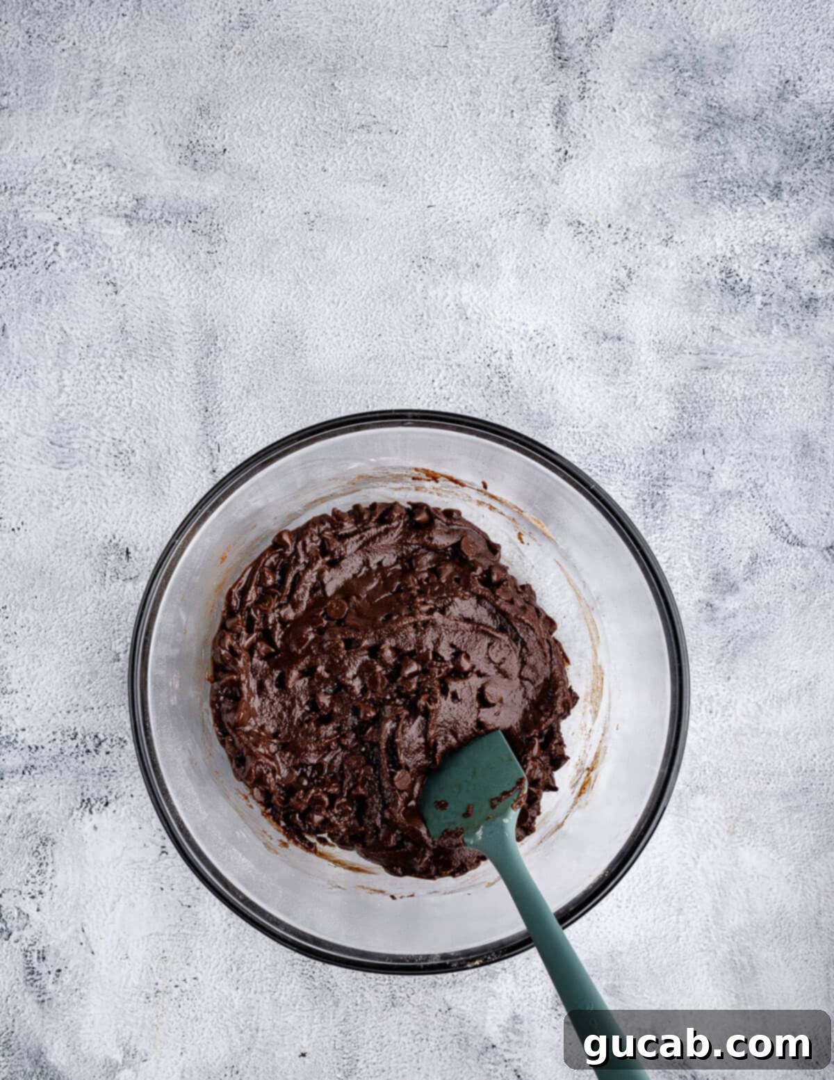 The dark chocolate cookie dough, soft and resembling brownie batter, after all ingredients are mixed.