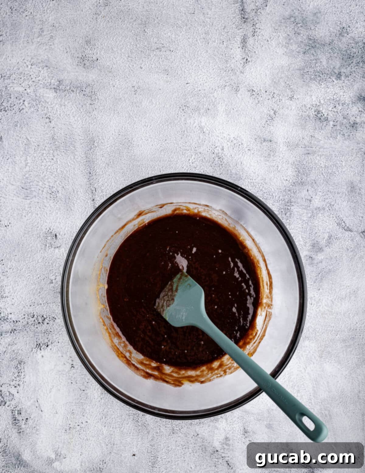 The chocolate and egg mixture thoroughly combined and smooth, ready for dry ingredients.