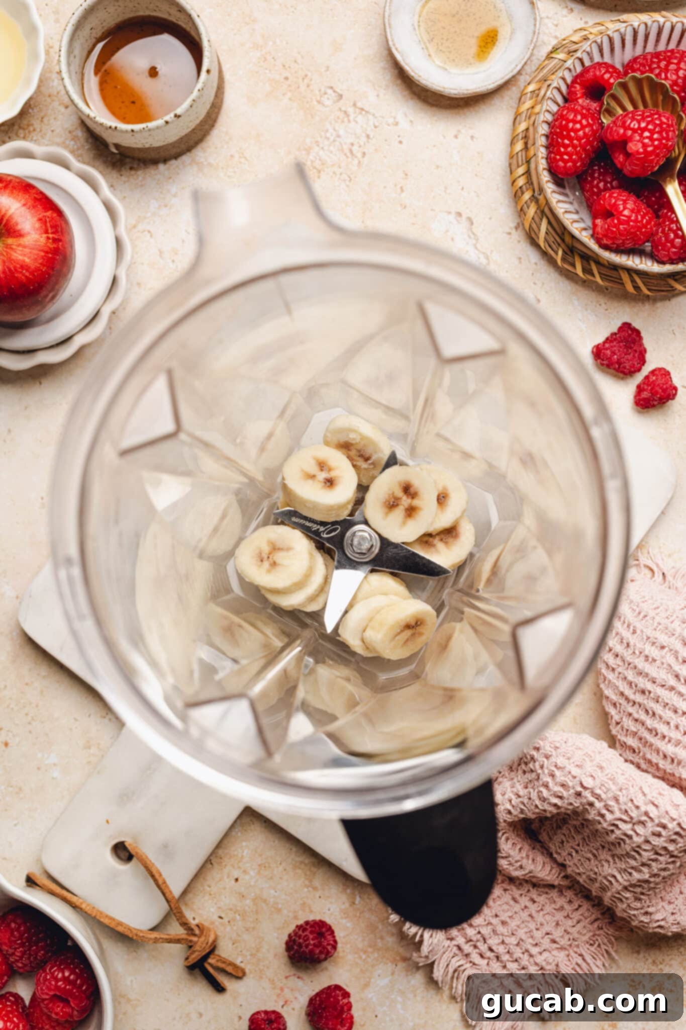Frozen sliced bananas placed inside a high-speed blender container.