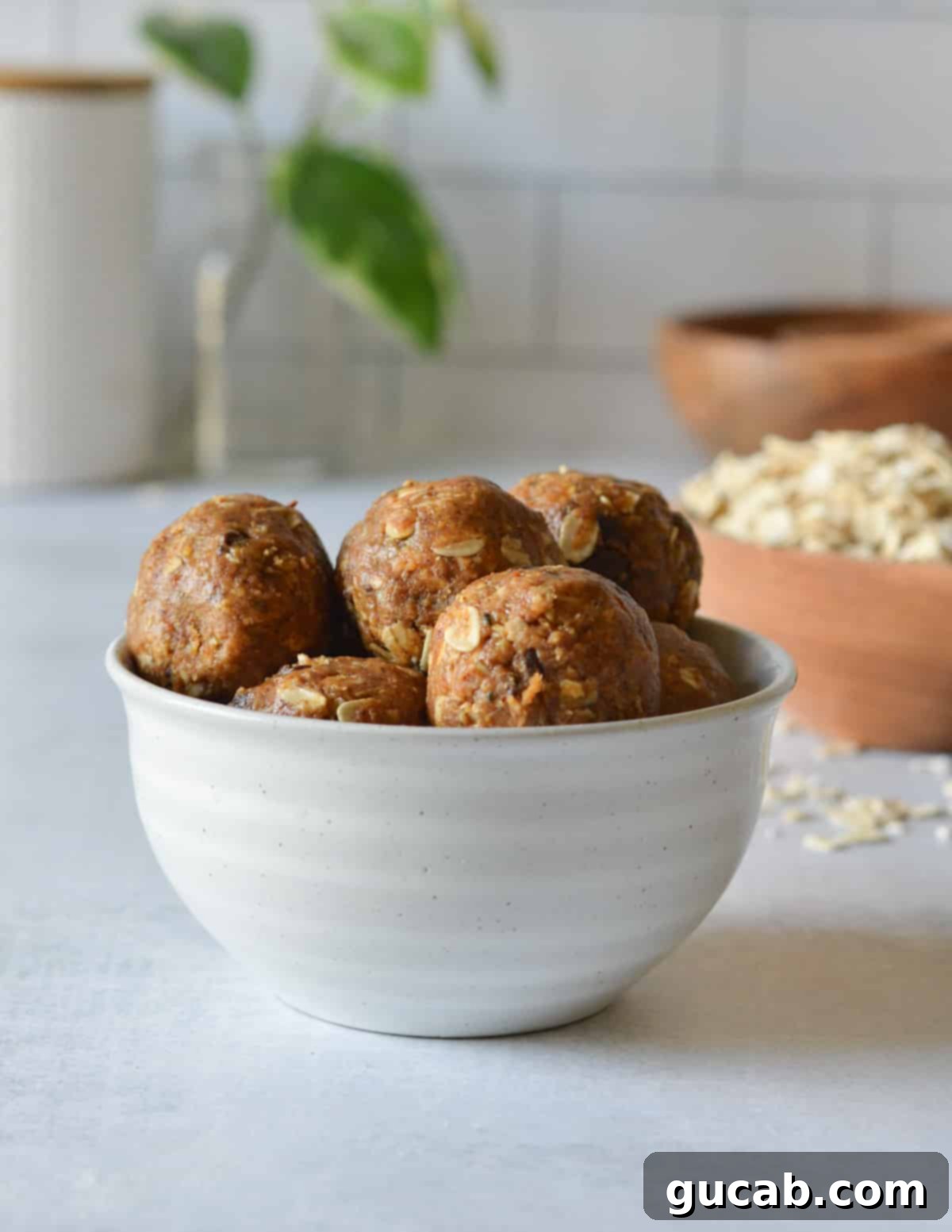 a bowl of almond butter balls 