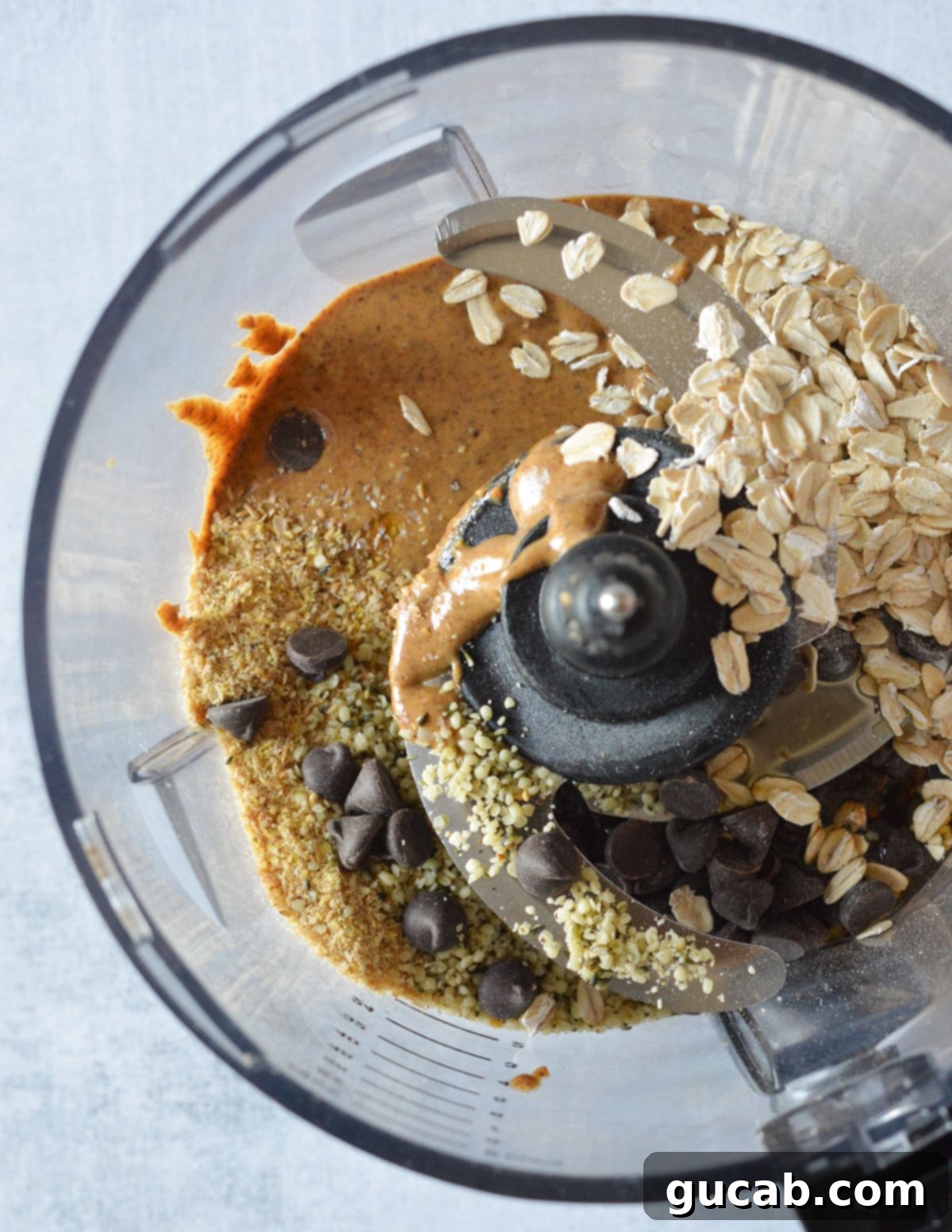 almond butter, oats, hemp hearts, chocolate chips, and flax meal in a food processor. 