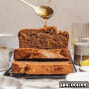 sliced banana bread with honey drizzled on top