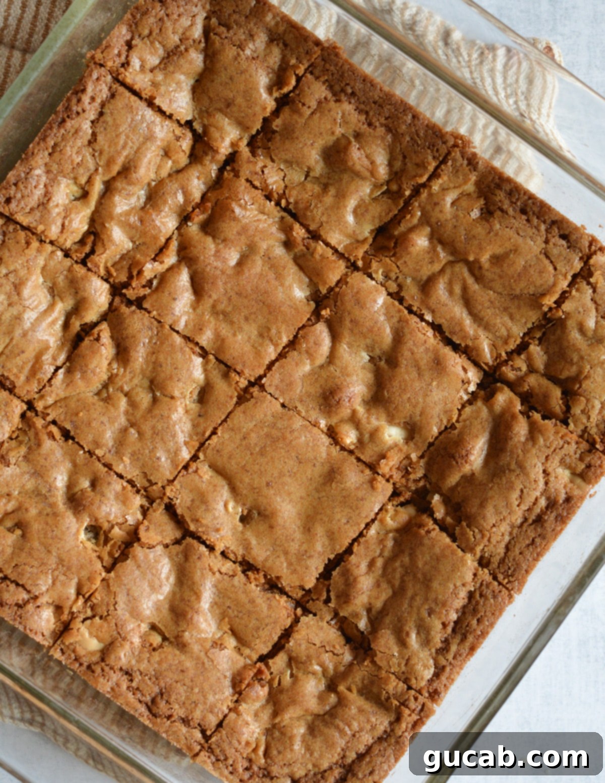 cut blondies in a baking dish.