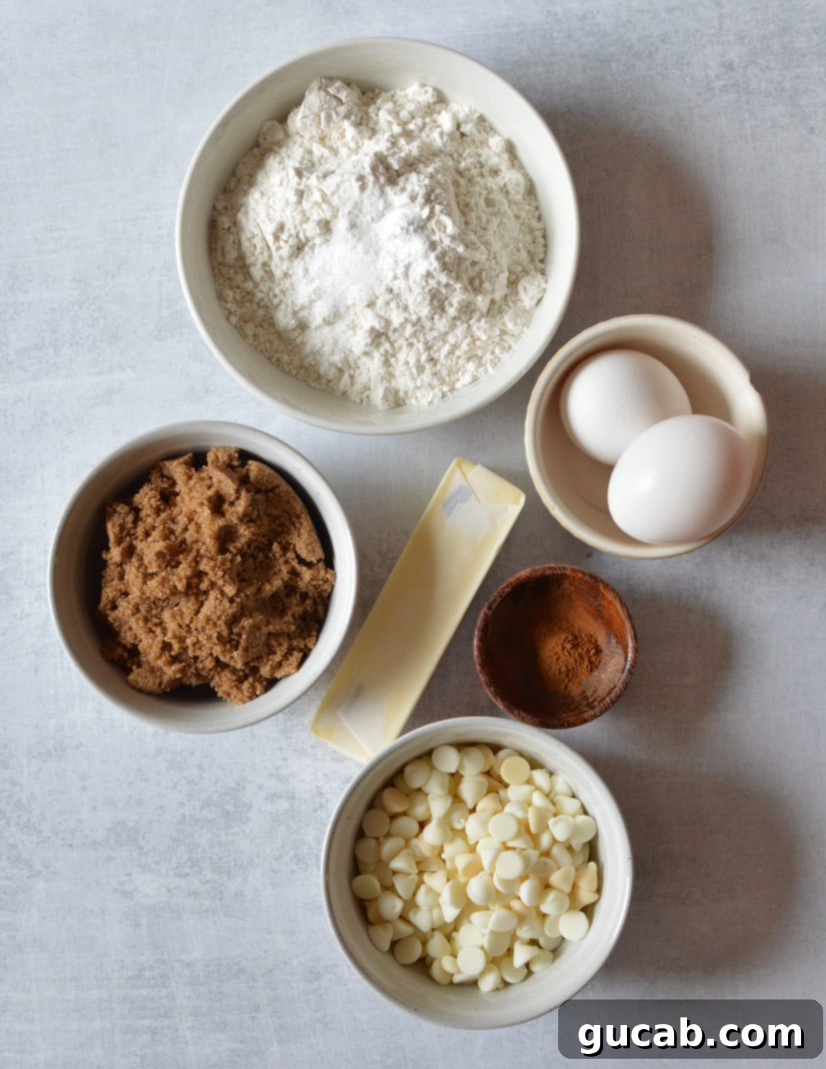 gluten-free flour, eggs, brown sugar, cinnamon, butter, white chocolate chips, baking powder, baking soda, salt, and cinnamon.