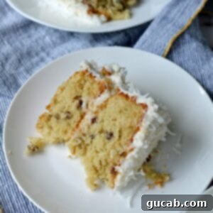 A slice of gluten free italian cream cake on a plate with fork