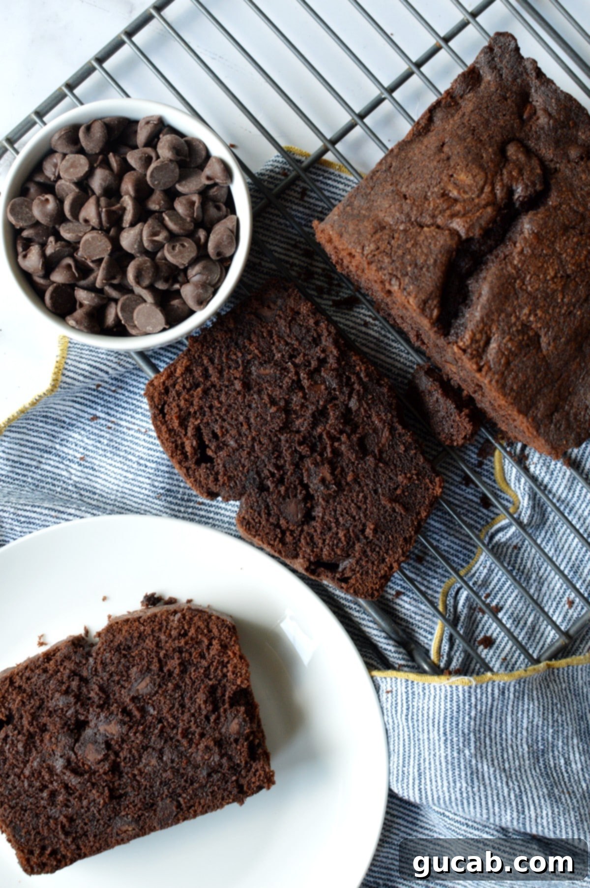 Decadent Gluten-Free Chocolate Pound Cake 2 A beautifully baked gluten-free chocolate pound cake cooling on a wire rack, ready to be sliced.