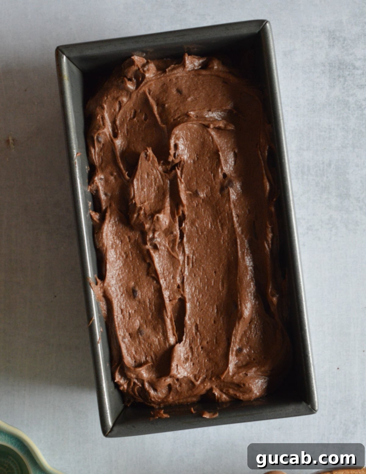 Decadent Gluten-Free Chocolate Pound Cake 11 The unbaked gluten-free chocolate pound cake batter, smooth and rich, in a loaf pan, ready for the oven.