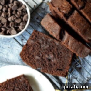 Decadent Gluten-Free Chocolate Pound Cake 14 A slice of moist gluten-free chocolate pound cake with chocolate chips.