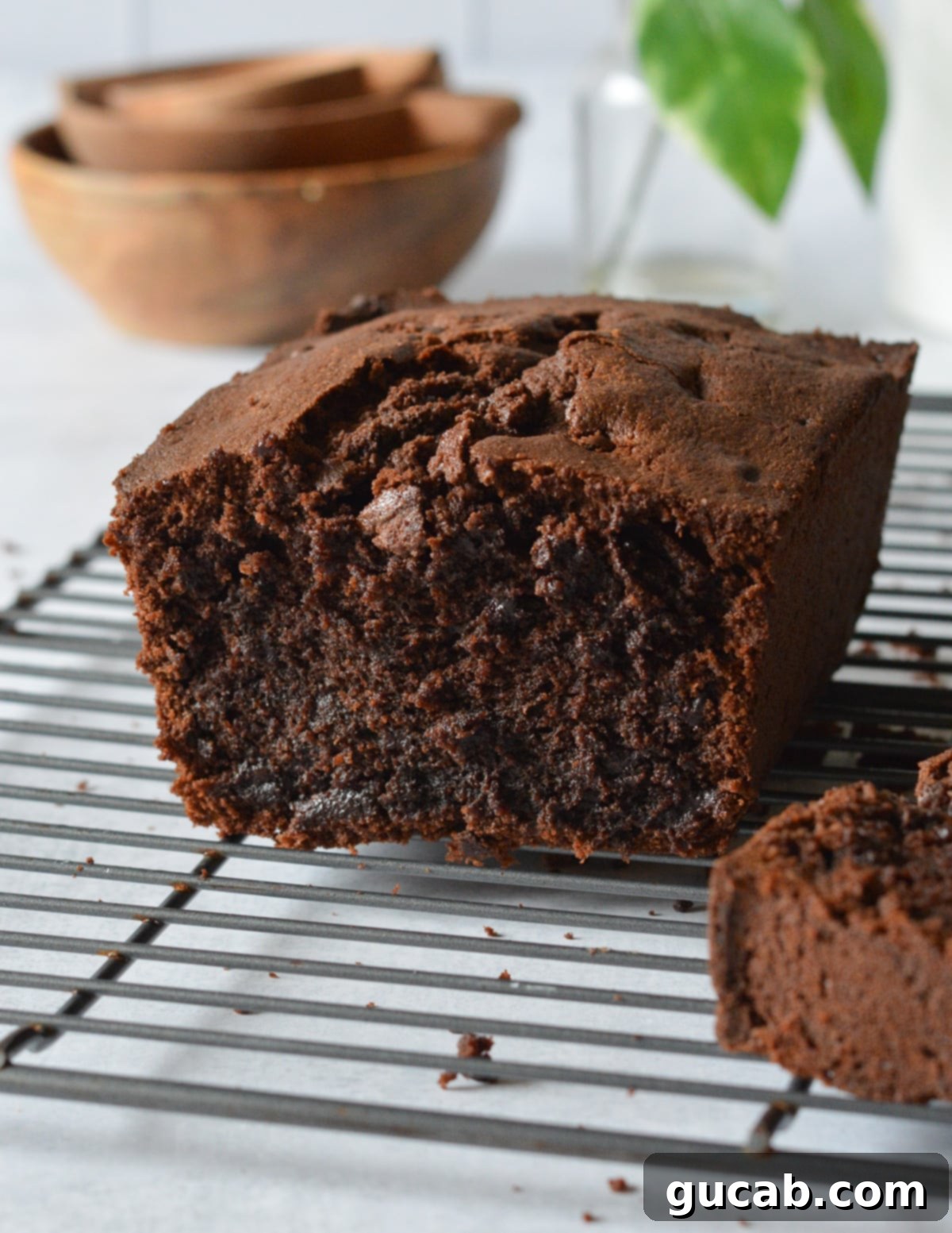 Decadent Gluten-Free Chocolate Pound Cake 4 A freshly baked gluten-free chocolate pound cake cooling on a wire rack, showing its perfectly golden-brown crust.