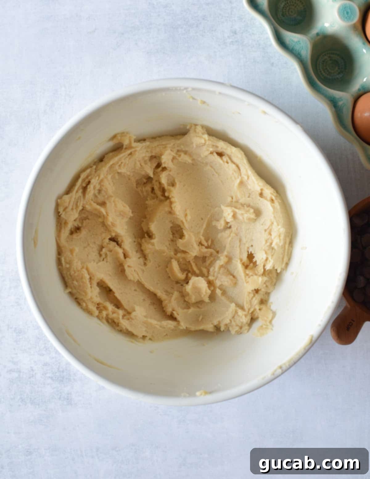 The result of creaming: a fluffy, light-colored mixture of butter and sugars in a mixing bowl.