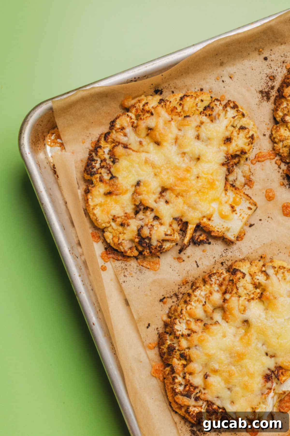 roasted cauliflower steaks with melted gouda cheese on top. 