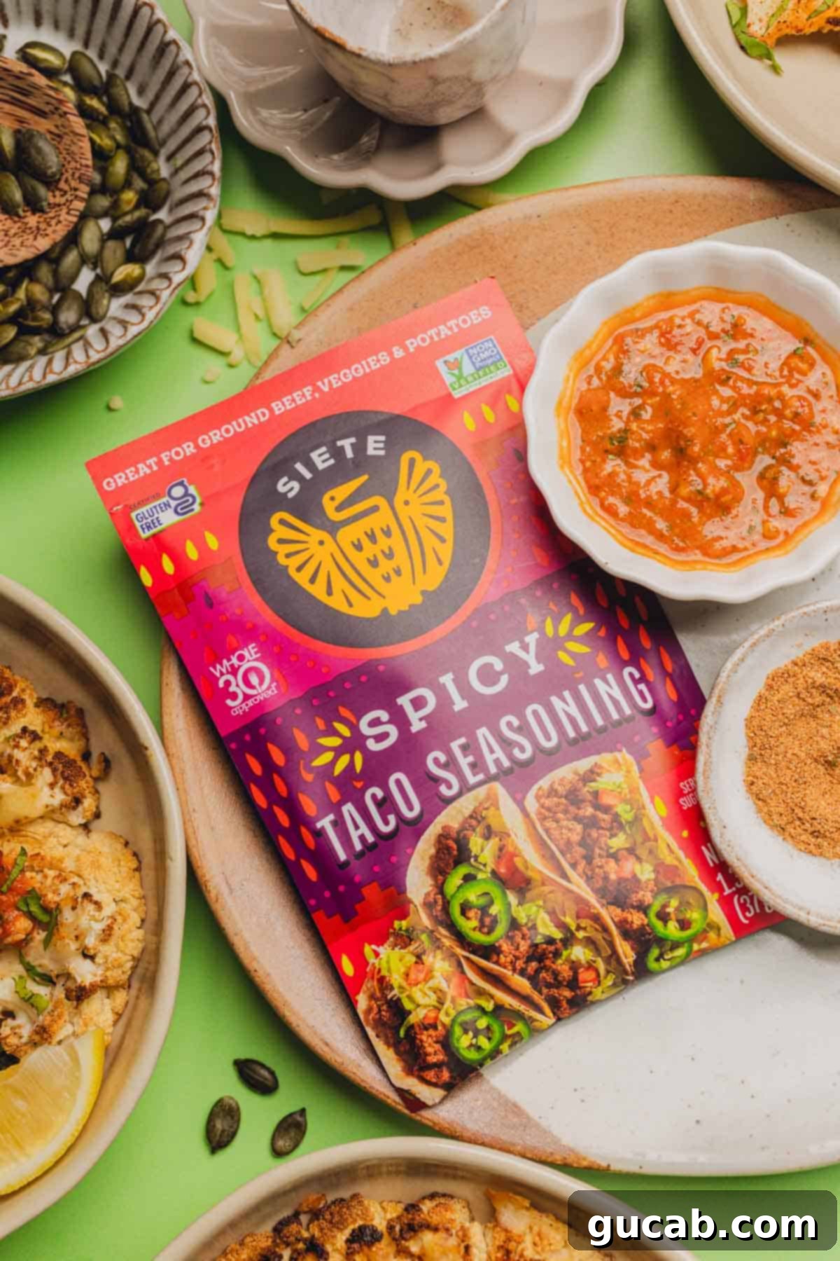 siete taco seasoning on a plate near salsa and roasted cauliflower. 