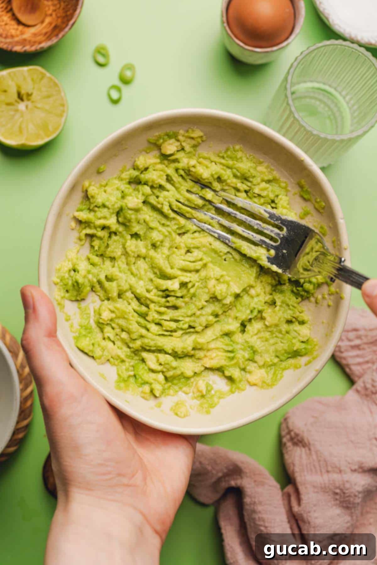 a bowl of mashed avocado 