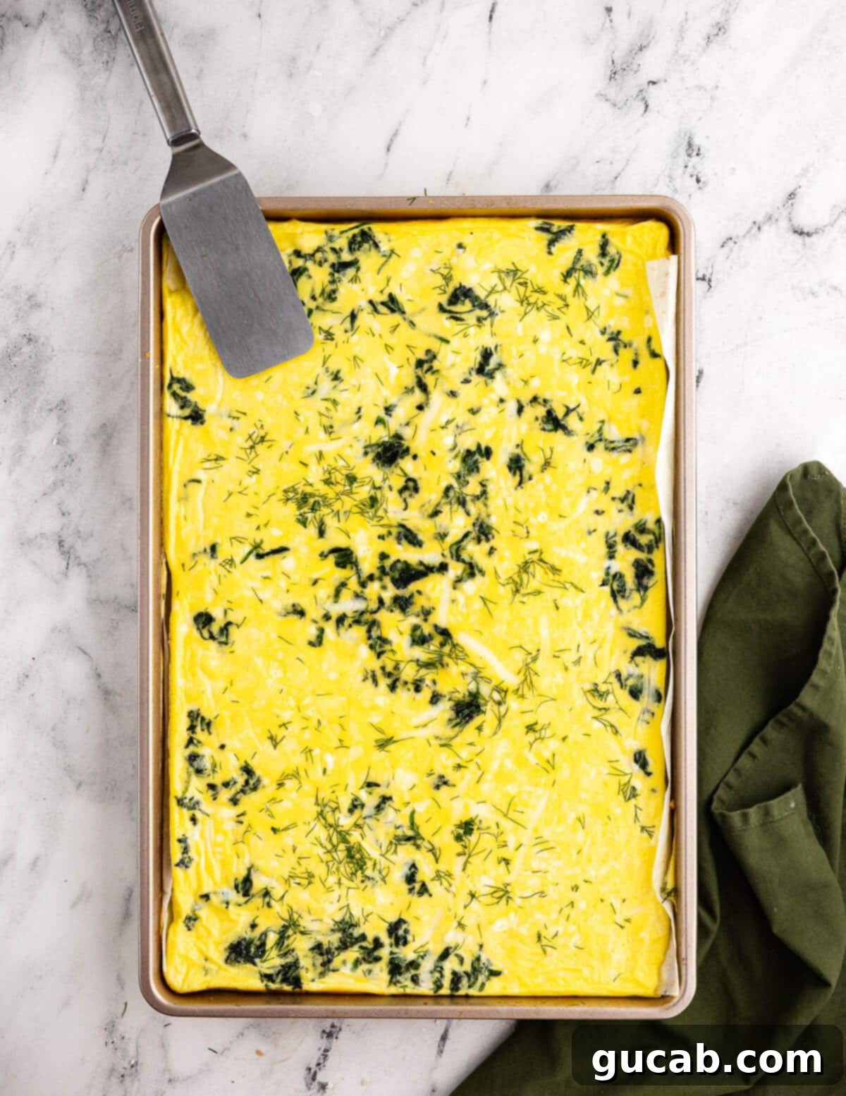 sheet pan egg bake with spinach, feta, and mozzarella. 