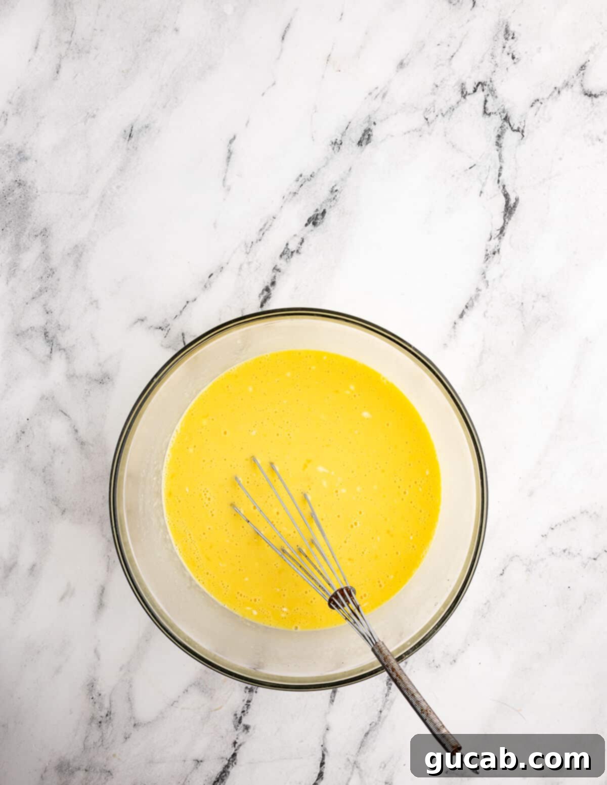 a bowl of whisked eggs. 