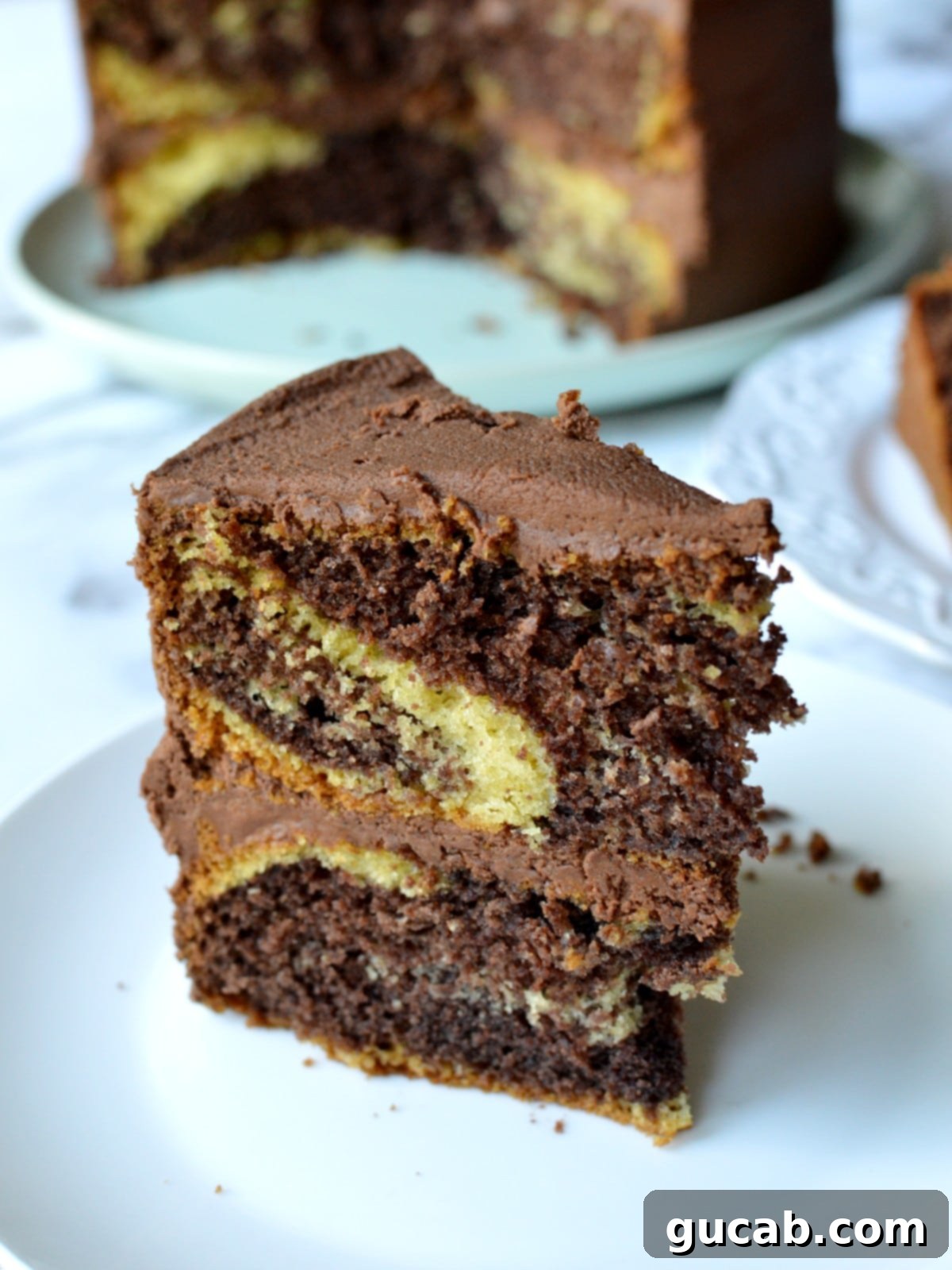 a slice of gluten free marble cake showing its perfect crumb and chocolate swirl