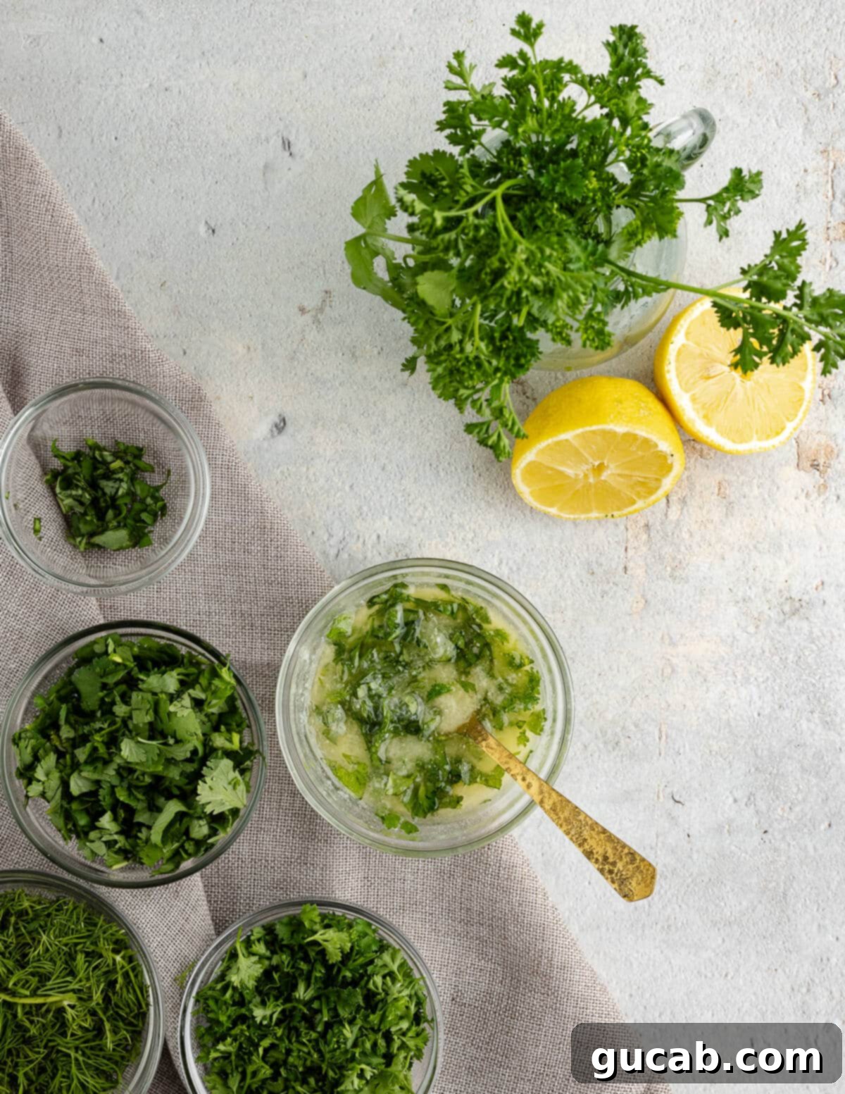 Small bowl containing melted butter, fresh lemon juice, and finely minced fresh herbs, ready to be mixed.