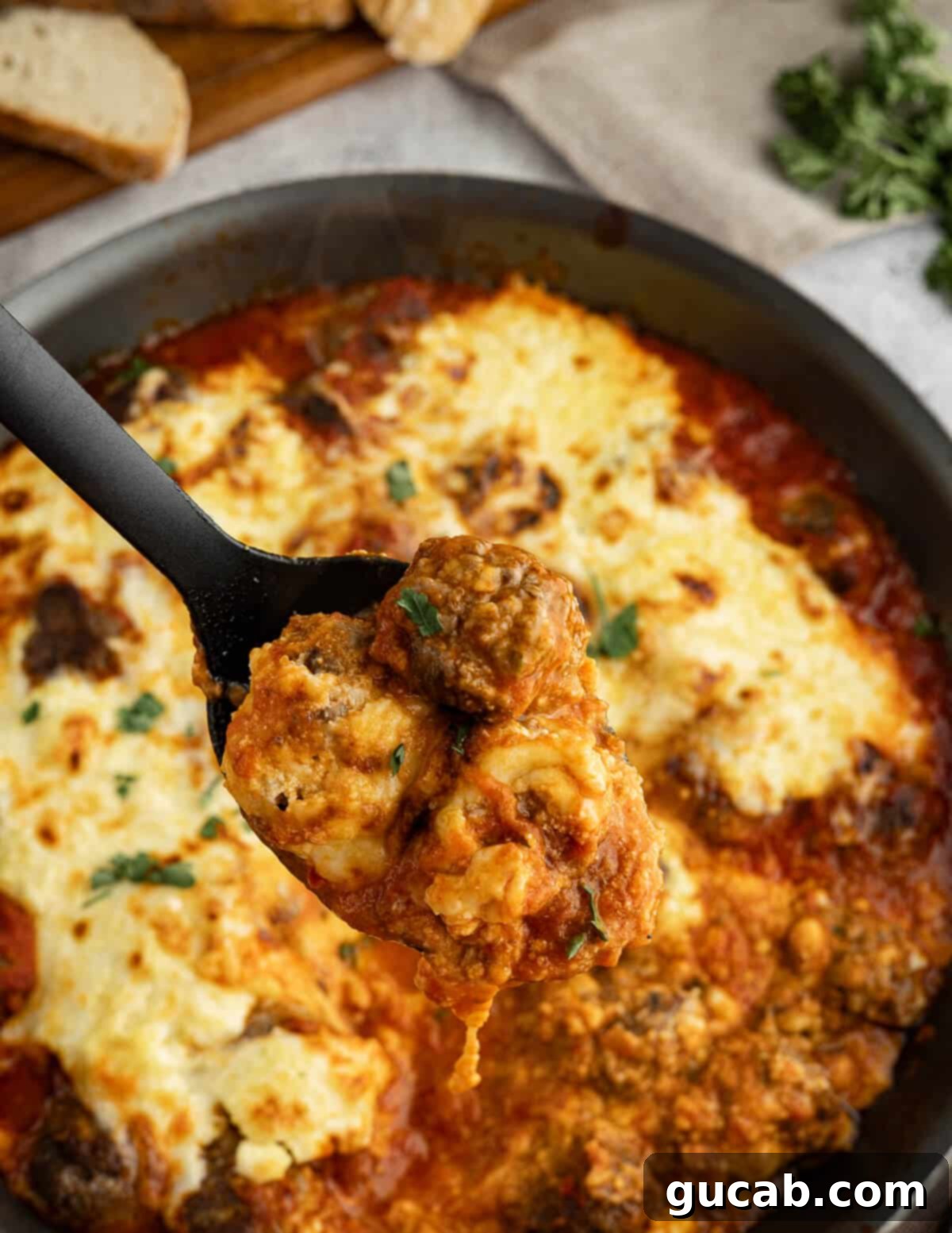 One-Pan Cheesy Meatballs 2 A generous spoonful of cheesy meatballs with marinara sauce, perfectly melted cheese.