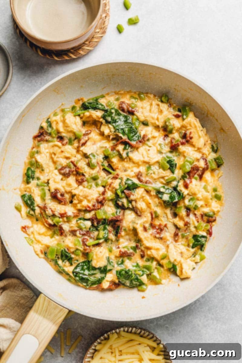 veggie egg scramble in a skillet.
