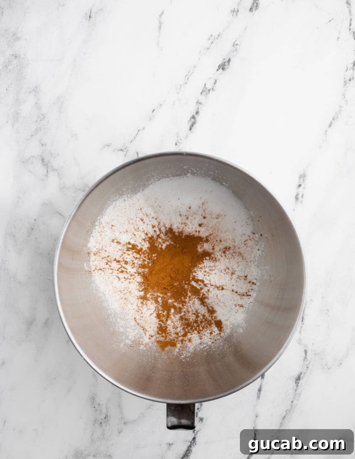 Golden Gluten-Free Graham Delights 5 gluten-free flour, cinnamon, sugar, and baking powder mixed in a bowl, ready for wet ingredients.