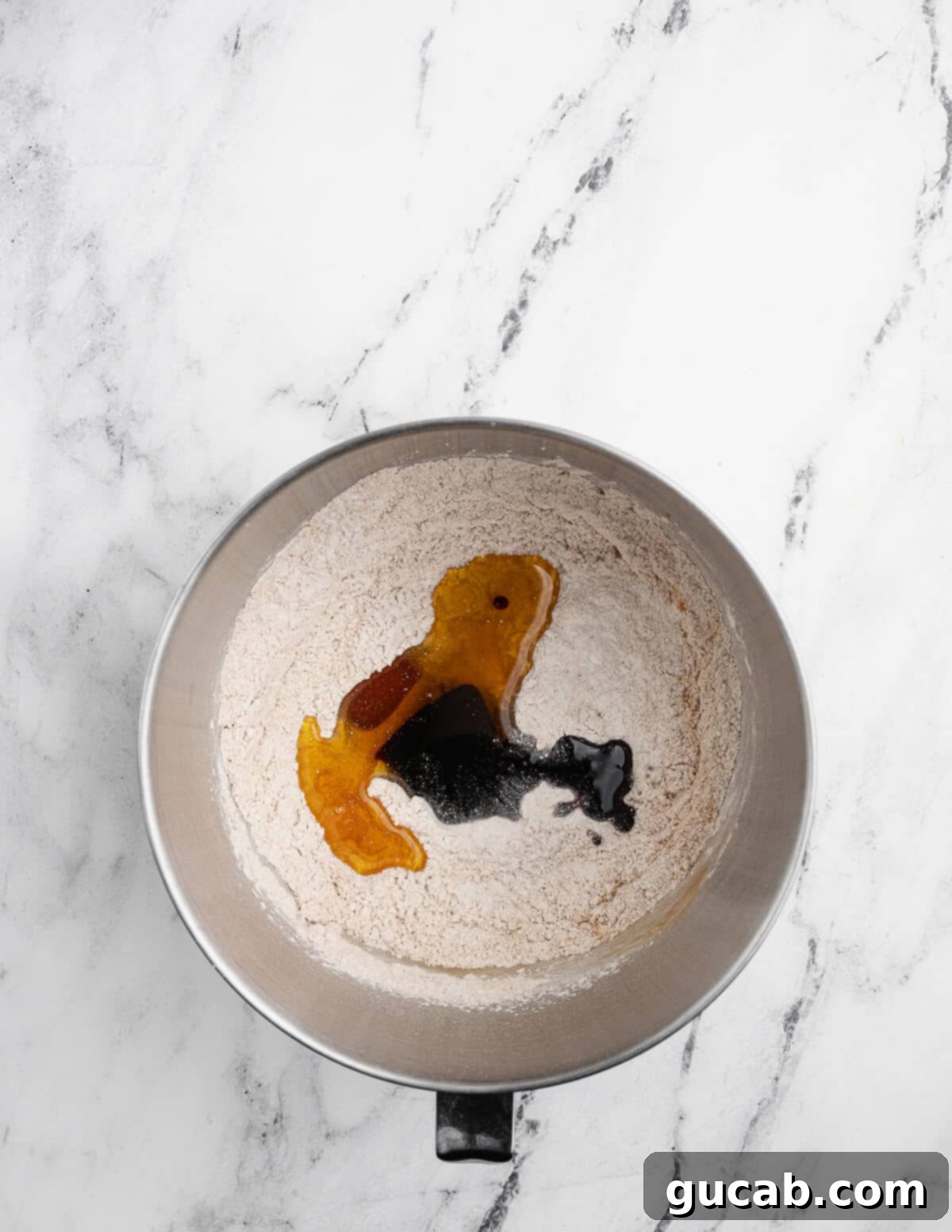 Golden Gluten-Free Graham Delights 6 gluten-free flour, cinnamon, sugar, baking powder, honey, and molasses partially mixed in a bowl.