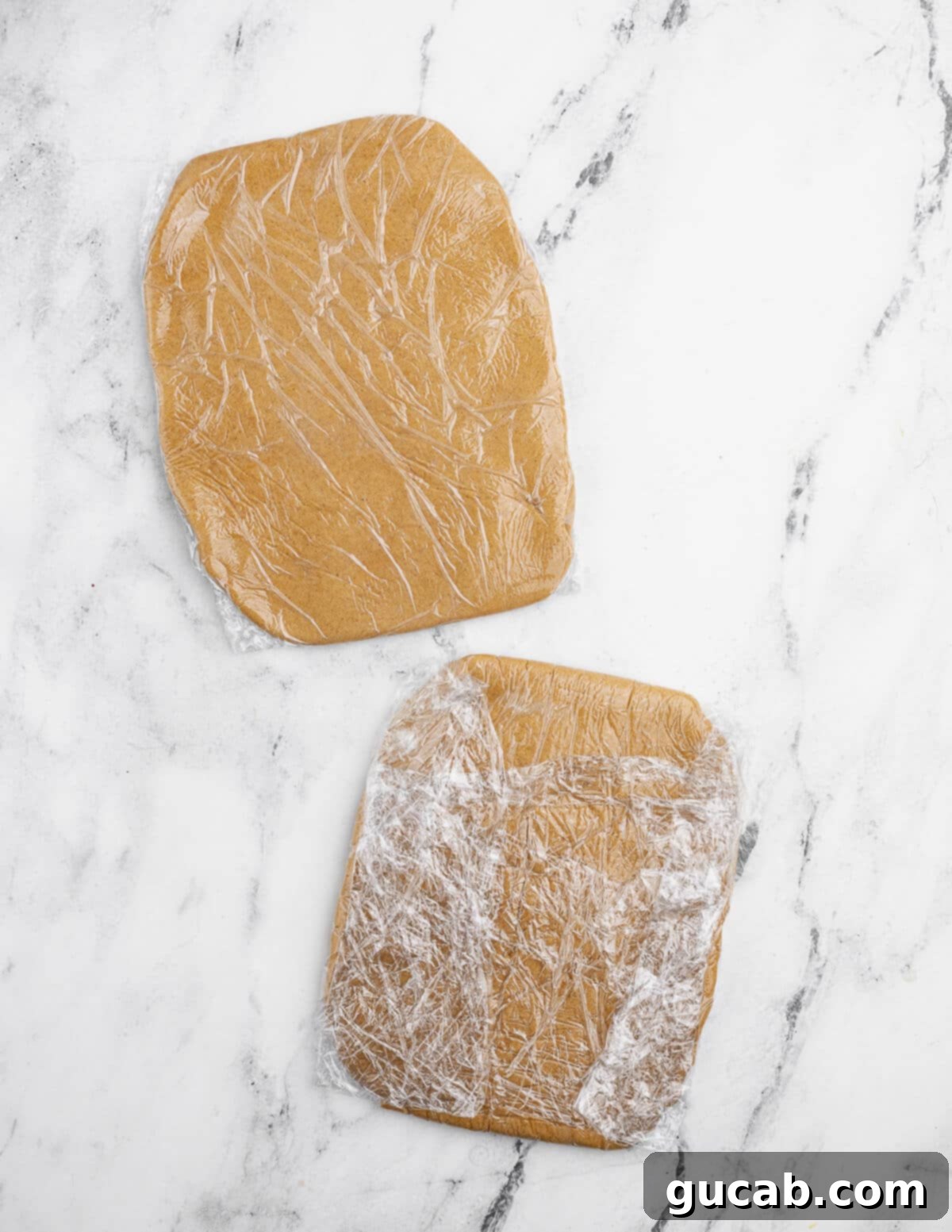 Golden Gluten-Free Graham Delights 10 two saran-wrapped cookie dough rectangles, ready for chilling.