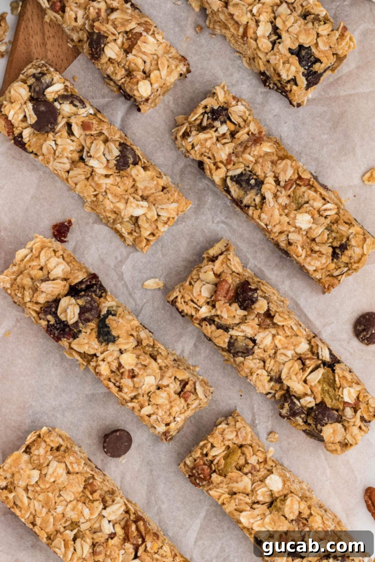 Delicious homemade granola bars artfully arranged on parchment paper, ready to be enjoyed as a healthy and satisfying snack.