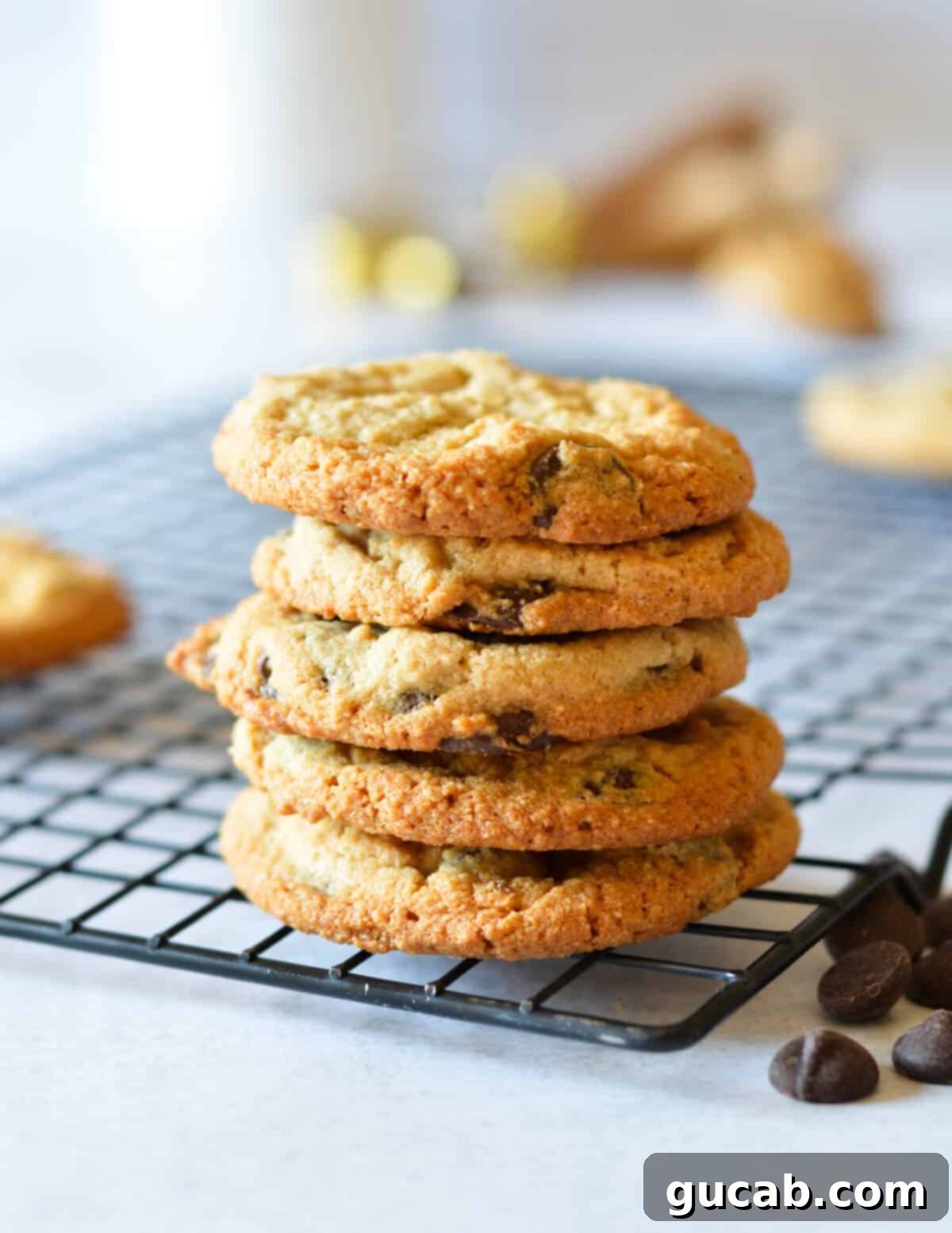A neatly stacked pile of freshly baked almond flour peanut butter cookies, showing their perfect form and texture.