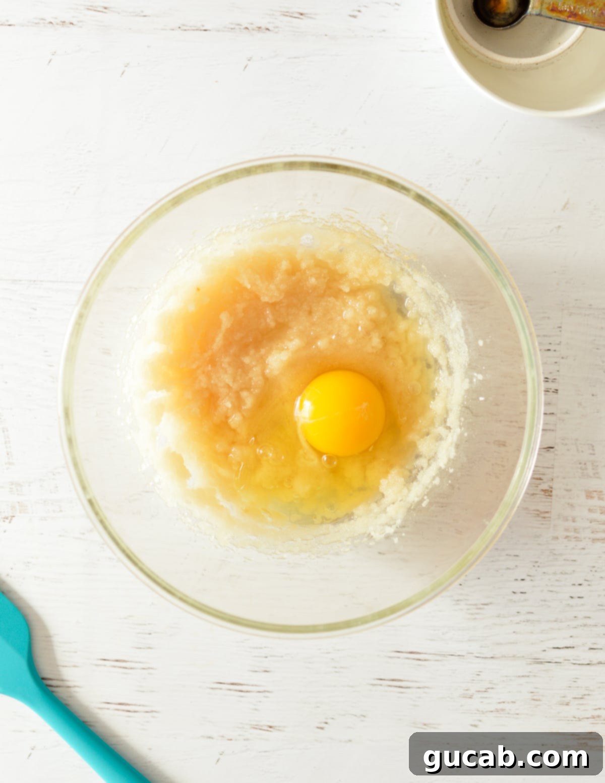 Beaten sugar and oil with an egg just added on top.