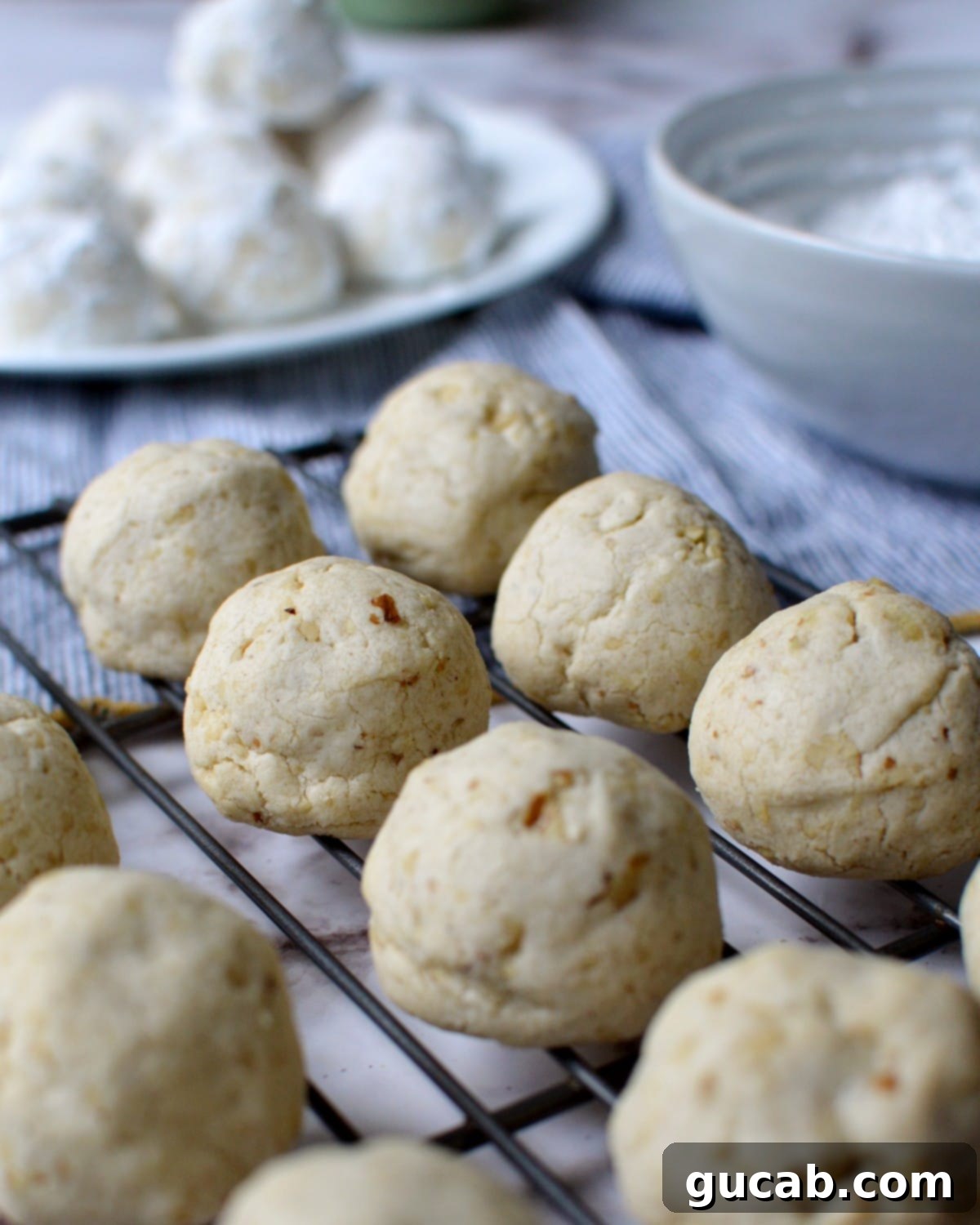 gluten free russian tea cakes on a cooling rack