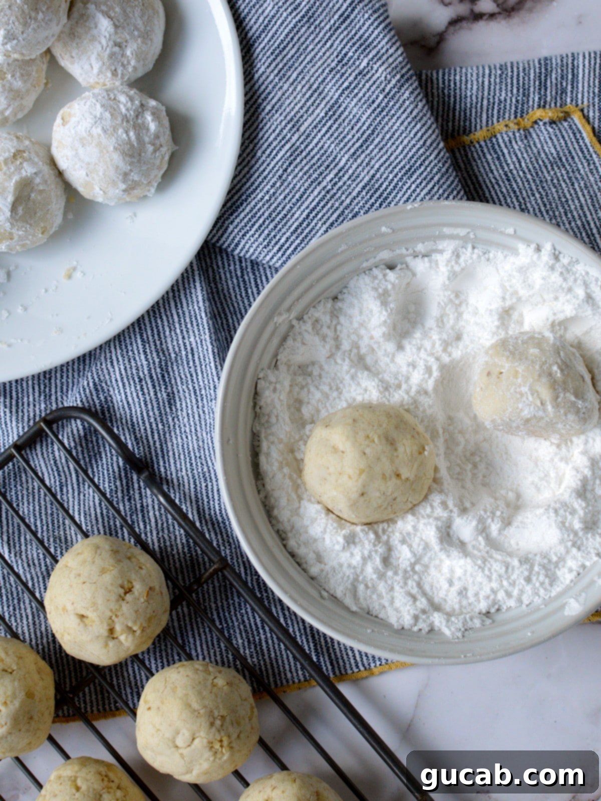 rolling cookies in powdered sugar