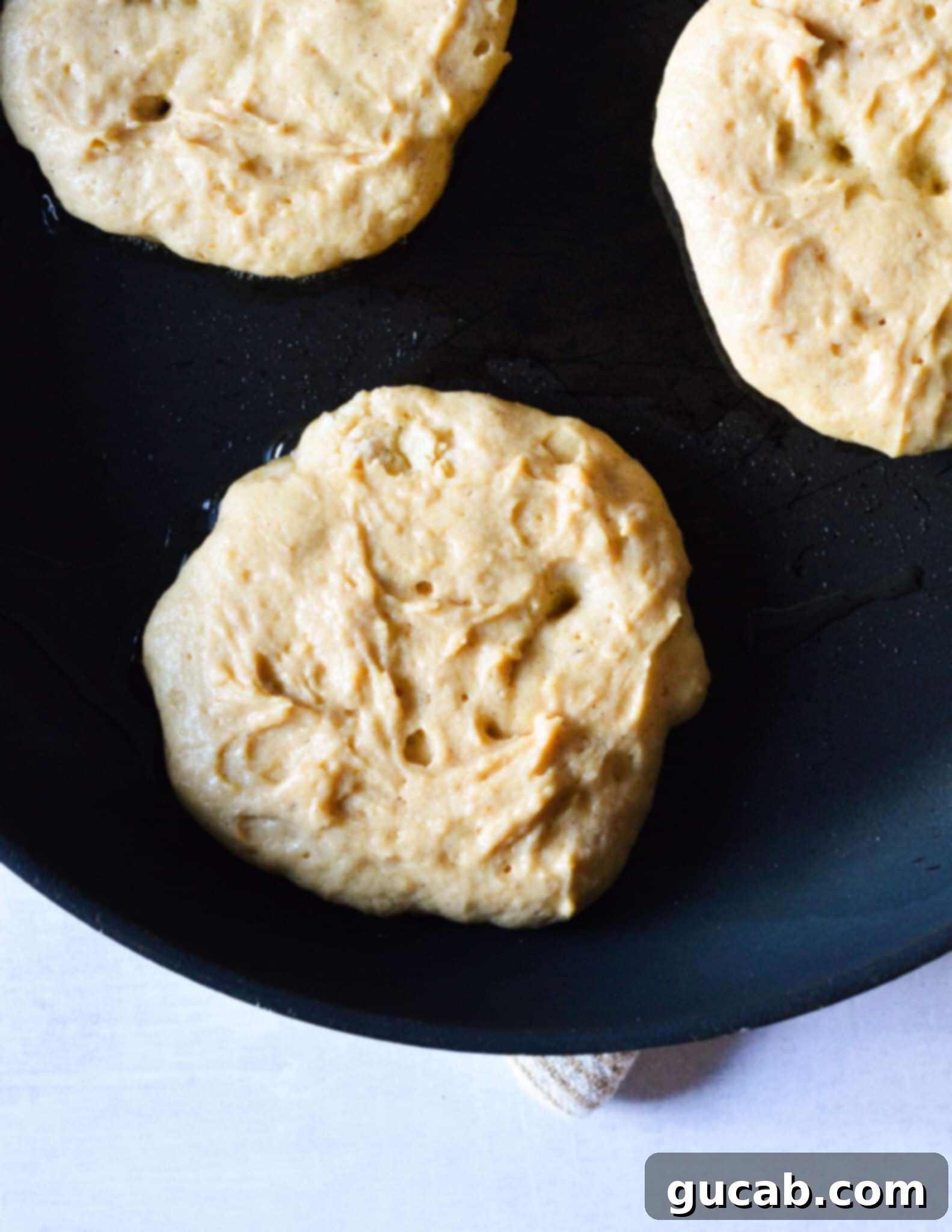 pancake batter in a skillet. 