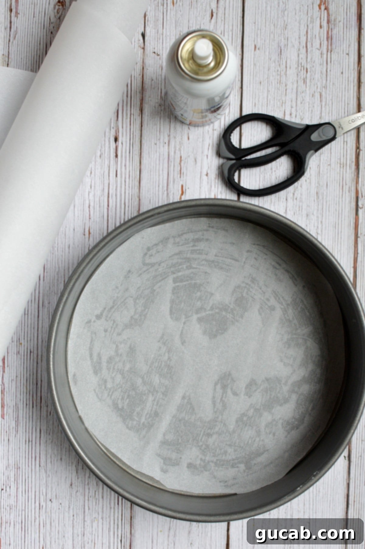 Ultimate Gluten-Free Cookie Cake 4 a cake pan lined with parchment paper, ready for cookie dough