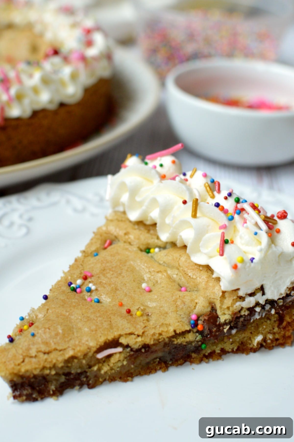 Ultimate Gluten-Free Cookie Cake 8 a decorated slice of gluten free cookie cake with sprinkles