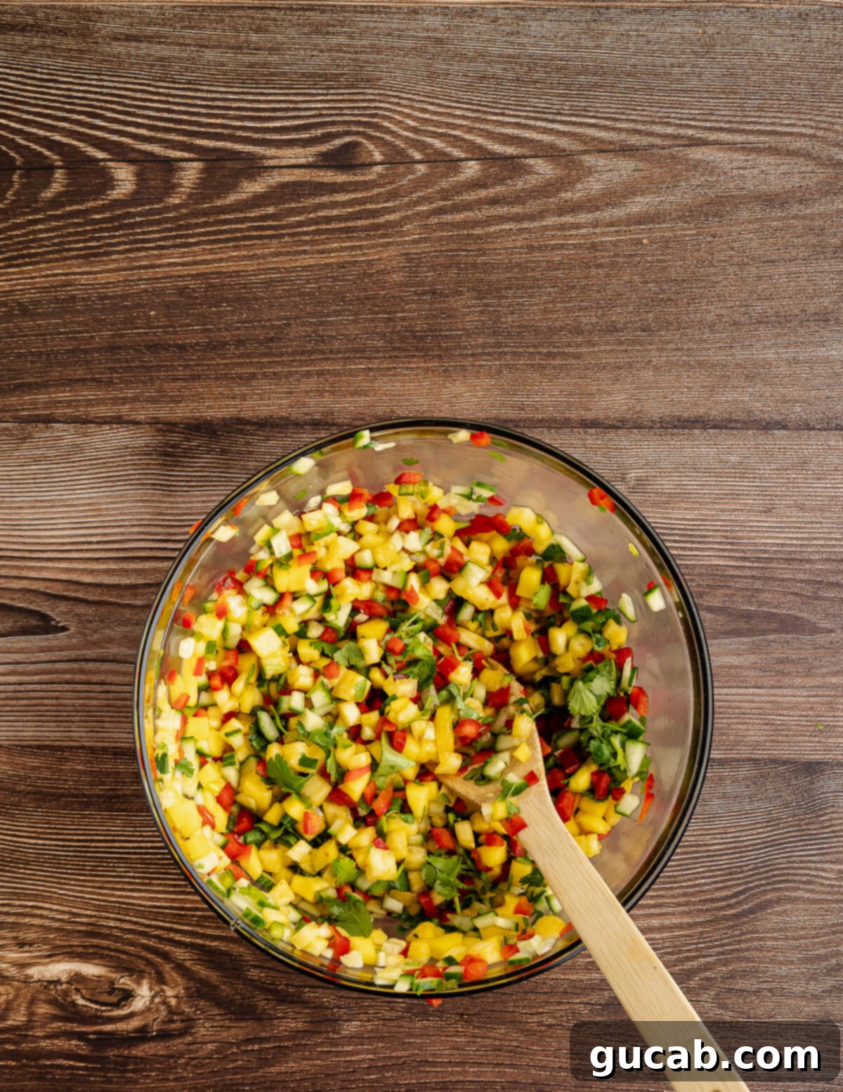 a large bowl of pineapple mango salsa. 