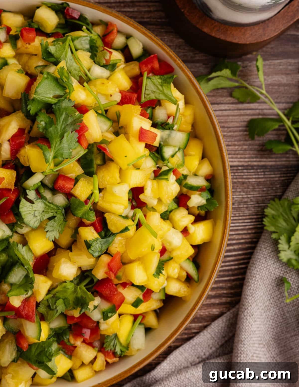 close up of pineapple mango salsa in a bowl. 