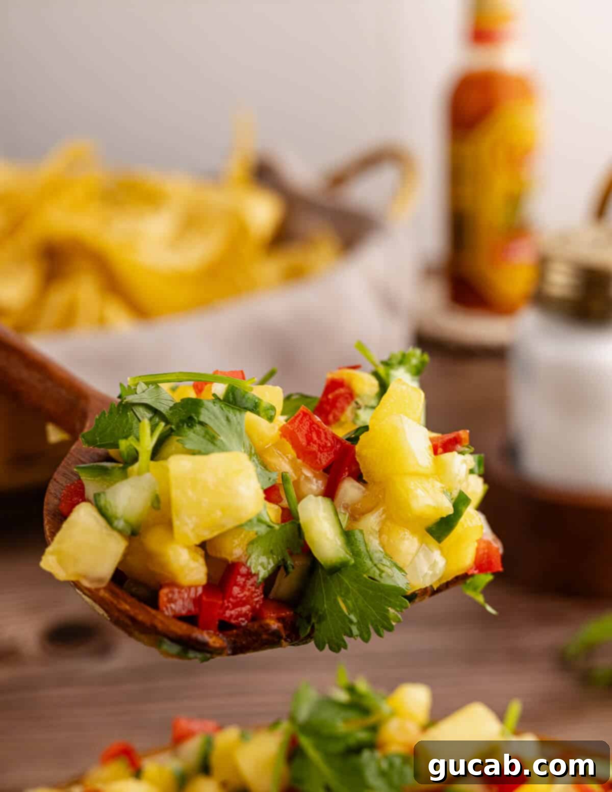 a spoonful of pineapple mango salsa. 