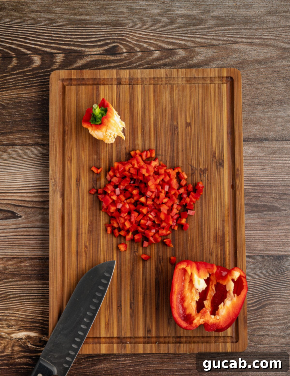 diced red bell pepper on a cutting board. 