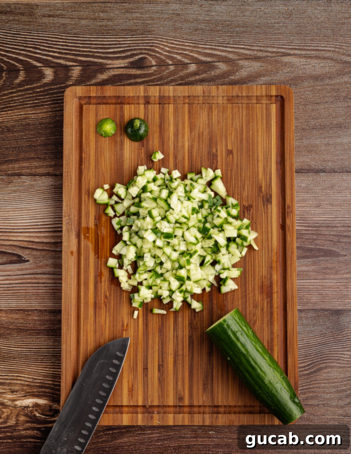 diced cucumber on a cutting board. 