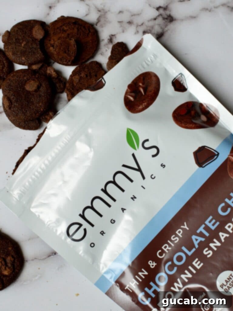 Emmy's Organics Thin & Crispy Chocolate Chip Brownie Snaps, small and rich, ideal for snacking.