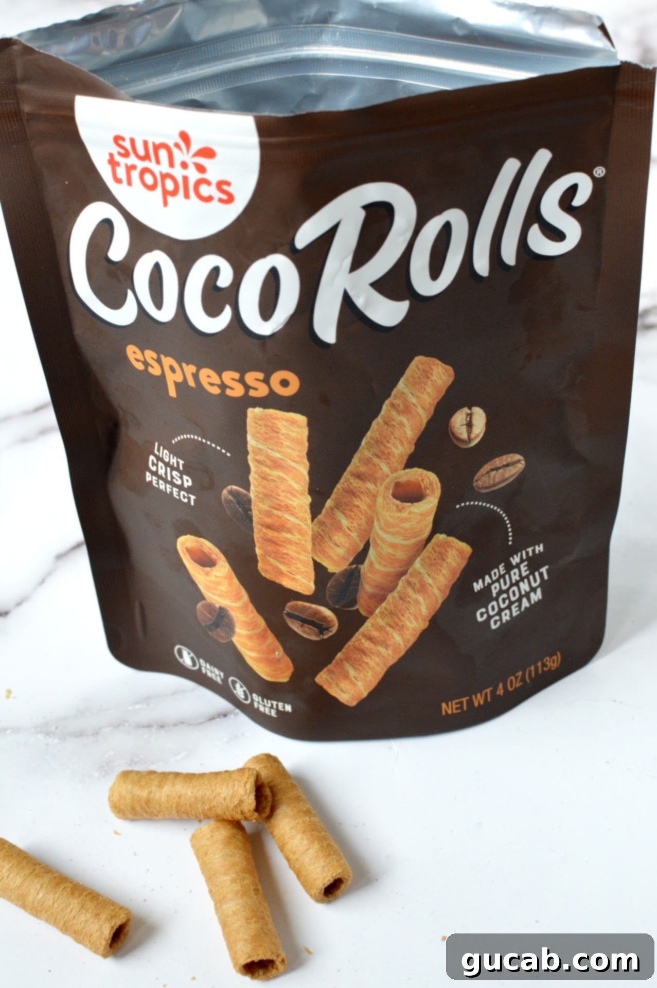 Sun Tropics Coco Rolls, crispy rolled coconut cookies, displayed on a plate, ready to be enjoyed.