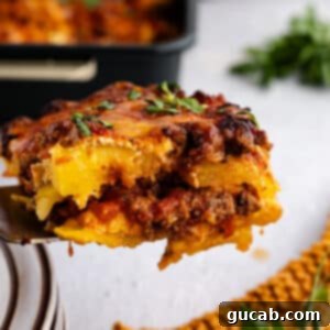 Gluten-Free No-Noodle Butternut Squash Lasagna 16 A scoopful of the delicious noodle-less butternut squash lasagna, showing creamy layers and golden cheese.