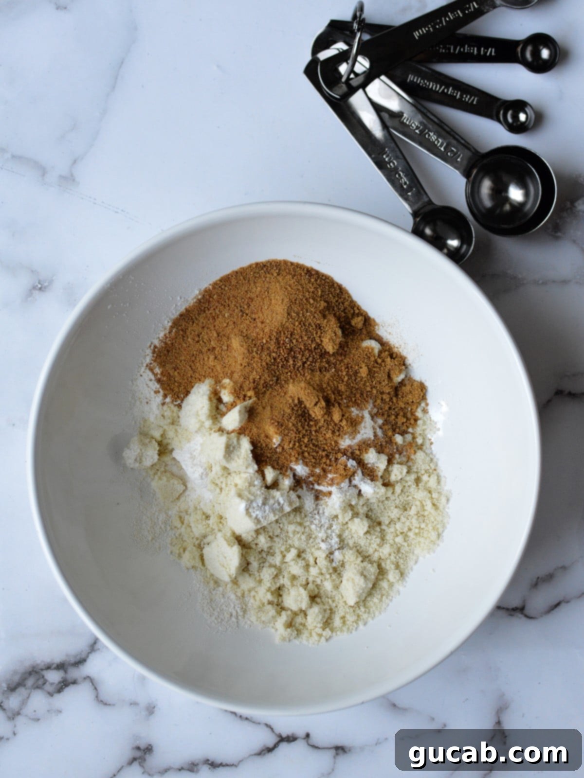 dry ingredients for paleo pancakes in a bowl
