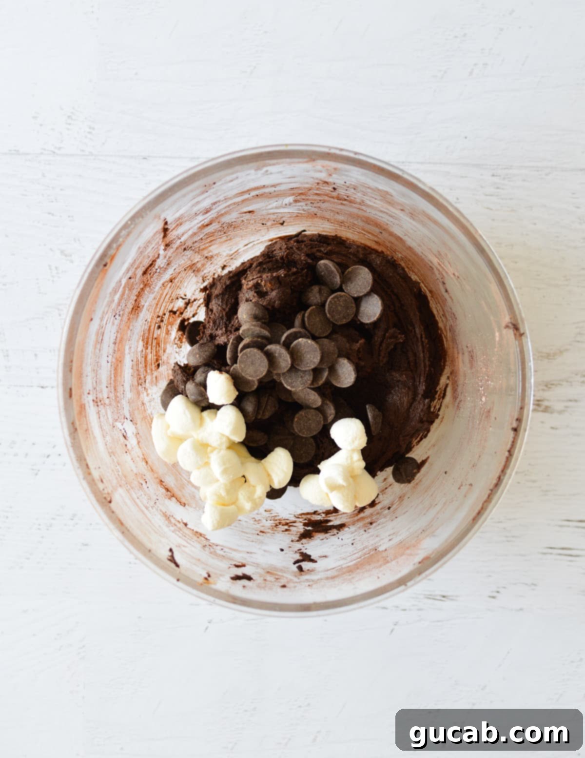 Chocolate cookie dough with mini marshmallows and extra chocolate chips folded in.