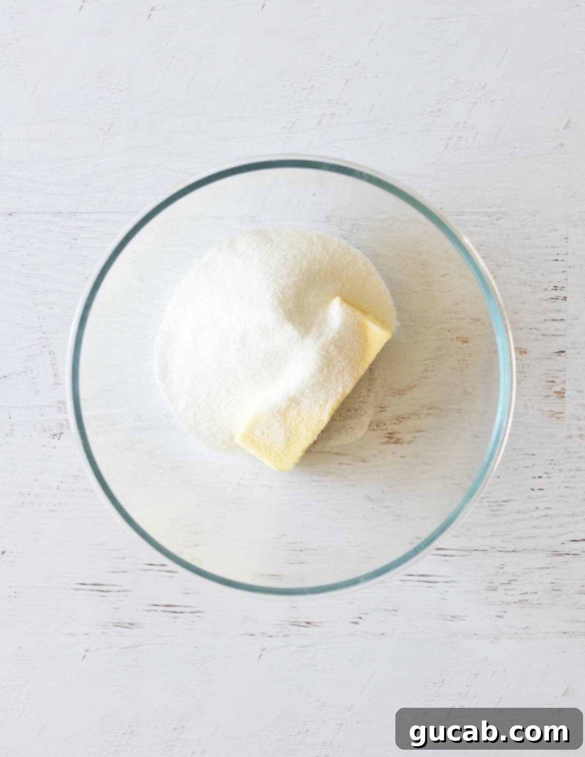 Butter and sugar initially mixed in a bowl, ready for creaming.