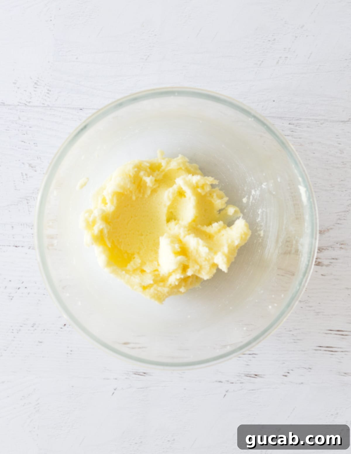 Creamed butter and sugar in a bowl, light and fluffy.
